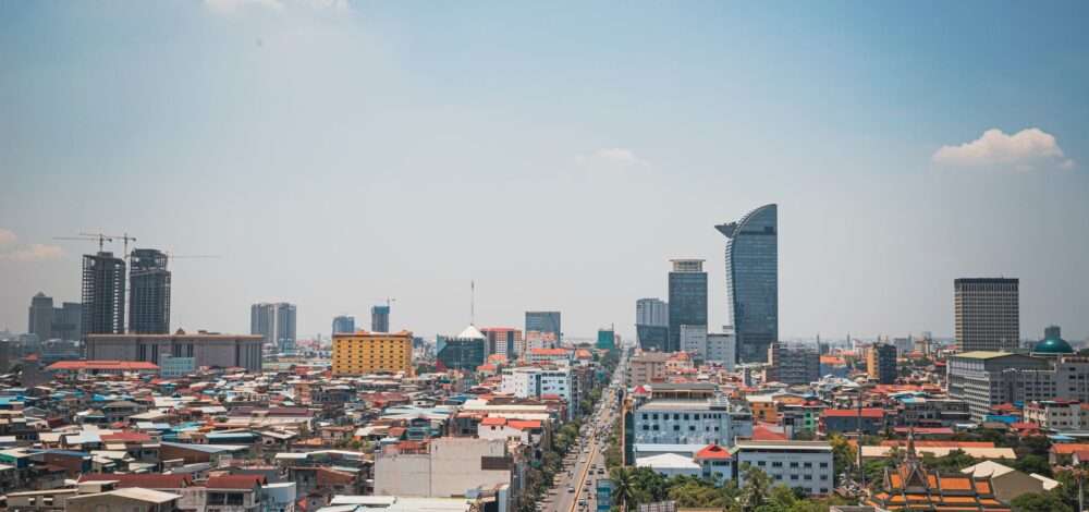 Aerial view of Phnom Penh city with casino resorts and urban landscape.
