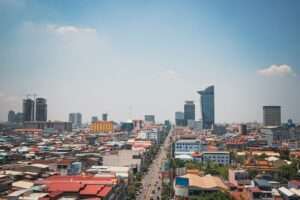 Aerial view of Phnom Penh city with casino resorts and urban landscape.