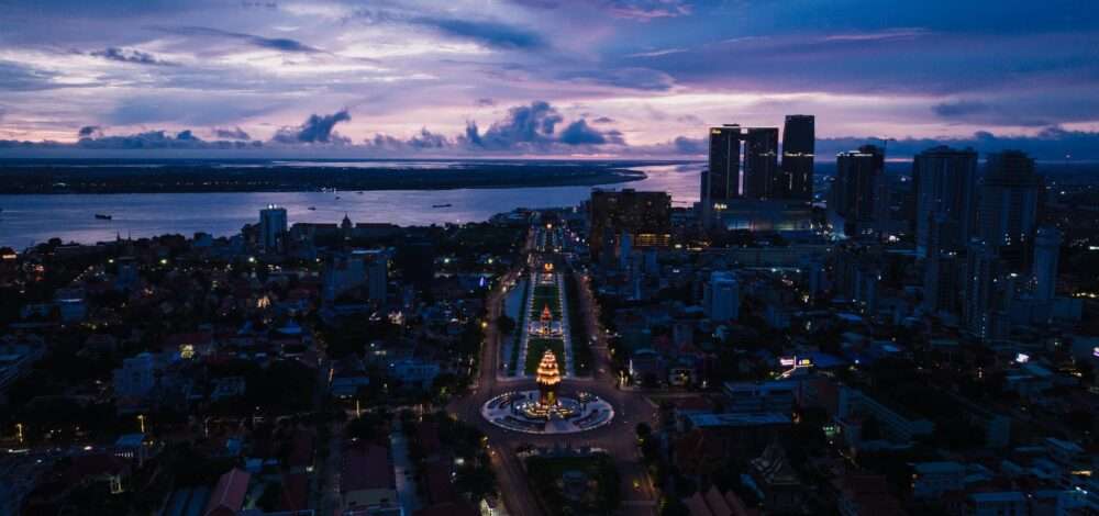 Aerial view of Phnom Penh skyline and Mekong river with casino lights at night