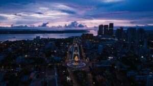 Aerial view of Phnom Penh skyline and Mekong river with casino lights at night