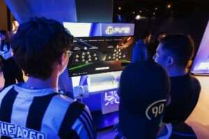 A futuristic slot machine interface displayed at a global gaming exhibition.