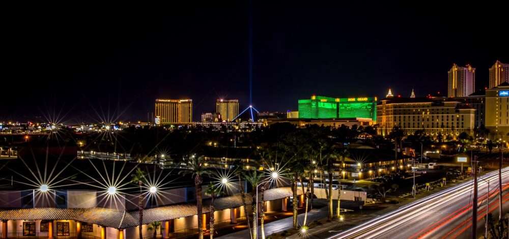 Aerial view of a bustling casino resort at night with bright lights