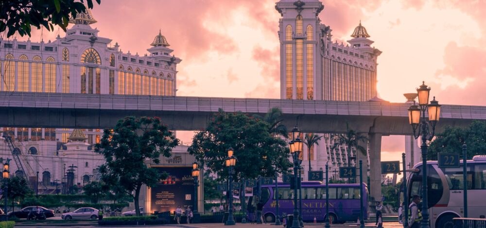 Macau casino skyline at night reflecting on water