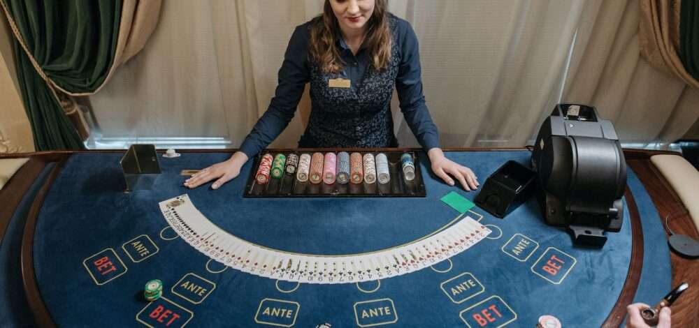 Modern casino floor with digital AI dealer interface