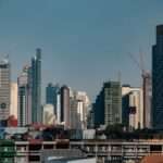 Aerial view of modern Bangkok city skyline with conceptual entertainment complex
