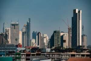 Aerial view of modern Bangkok city skyline with conceptual entertainment complex
