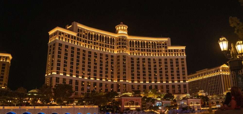 Aerial view of a modern integrated resort complex with lights at night