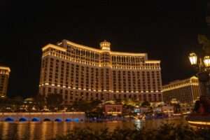 Aerial view of a modern integrated resort complex with lights at night