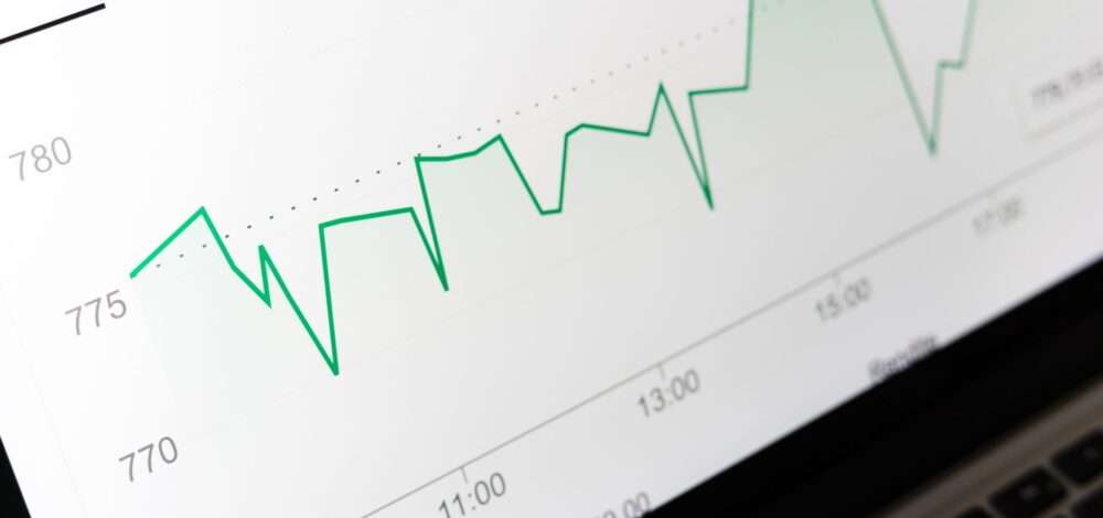 A digital interface showing sports betting analytics and data charts on a screen.