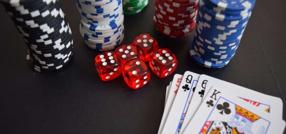 Financial charts and casino chips on a desk