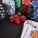 Financial charts and casino chips on a desk